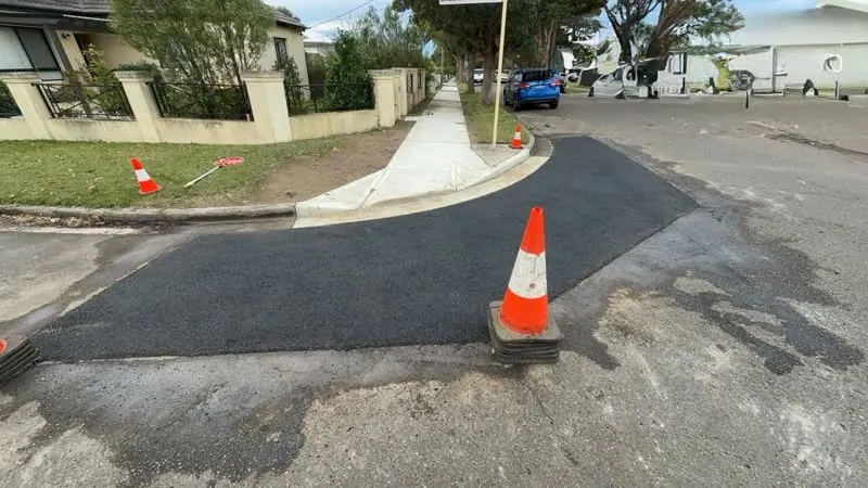 Curved driveway resurfacing on residential street
